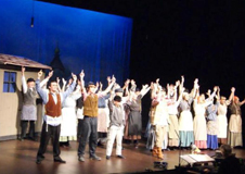 The chorus singing 'Tradition'